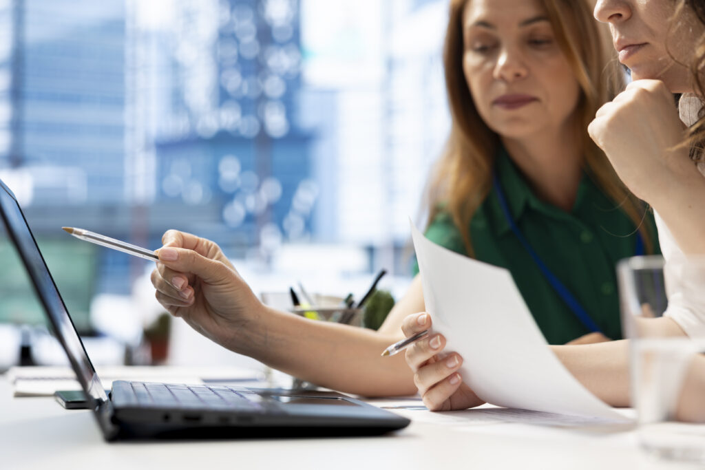 employers using laptop device find qualified candidates through job postings